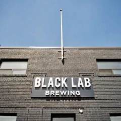The Black Lab Brewing sign above the front door