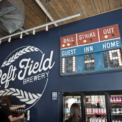 Checking the fridge at Left Field Brewery