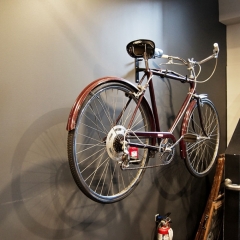 A bicycle adorns the wall in the basement of The Six Brewing